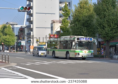 OSAKA, JAPAN - NOVEMBER 07, 2014: Bus in Japan stop at traffic light in Osaka