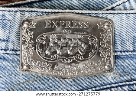 BANGKOK, THAILAND - APRIL 21, 2015: Close up of the old Rock Express metal label on the blue jeans.