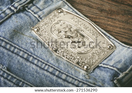 BANGKOK, THAILAND - APRIL 21, 2015: Close up of the old Rock Express metal label on the blue jeans.