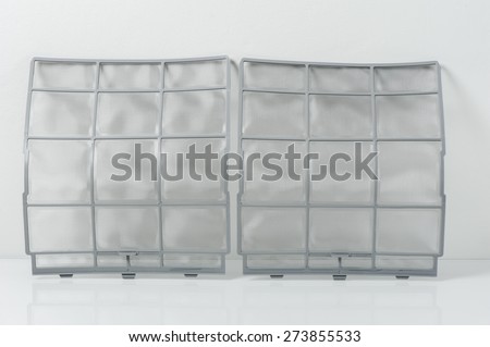 clean stainless air filter for wall type air conditioner on white background