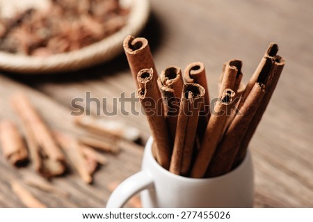 fragrant cinnamon sticks in white cup