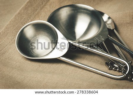 set of stainless steel measuring spoons in varying sizes