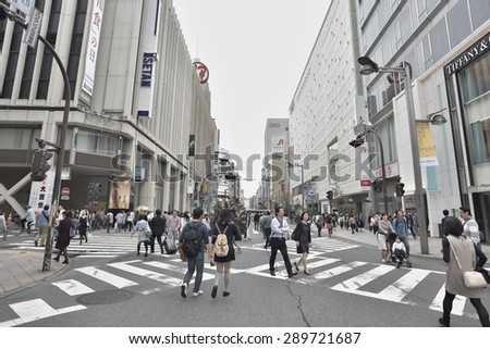 TOKYO, JAPAN - NOVEMBER 02, 2014: Many People walk in Shinjuku district of Tokyo. Tokyo is the capital city of Japan and the most populous metropolitan area in the world with almost 36 million people.