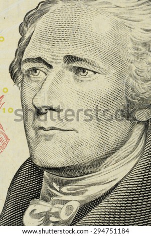 closeup Alexander Hamilton face on the US $10 dollar bill.