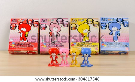 CHONBURI, THAILAND - AUGUST 10, 2015: Four different colour of assembled Petit\'gguy model kits with boxes.