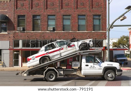 Wrecked Police Car Being Towed
