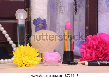 Jewelry and Cosmetics with Flowers on Vanity