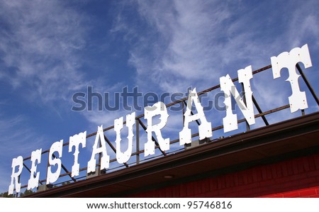Restaurant Sign With Blue Sky