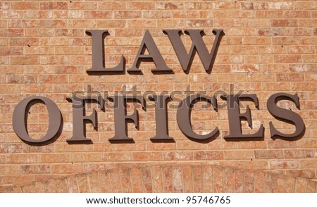 Law Offices Sign on Brick Wall