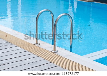 Stair in chrome color at swimming pool