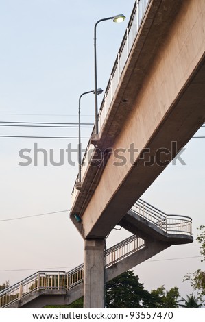 Overpass across the street with lamp poles
