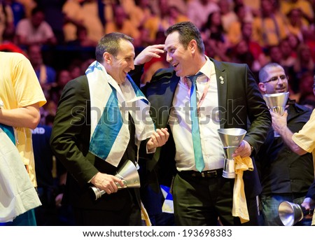 MILAN - MAY 18: Maccabi Electra Tel-Aviv\'s coaches David Blatt and Guy Goodes celebrate after beating Real Madrid and winning the Turkish Airlines Euroleague title in Mediolanum Forum on May 18, 2014.