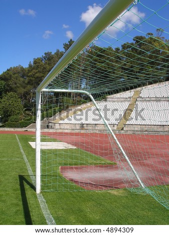 empty soccer stadium - view from the pitch, inside the goal