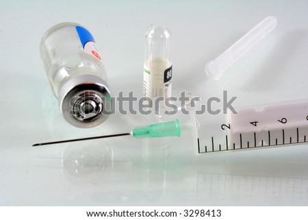 syringe needle and medical stuff on glass