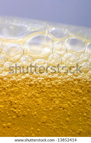 bubbles in beer or dishes soap shampoo close-up