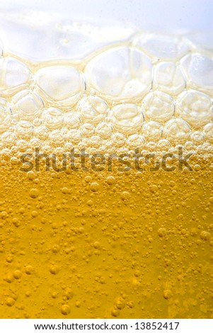 bubbles in beer or dishes soap shampoo close-up