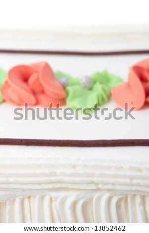 close-up of a cake with roses ornaments on it