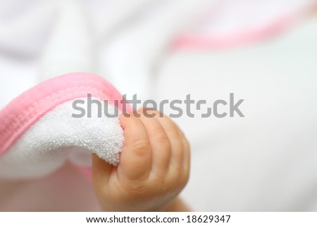 new born baby hand on white background