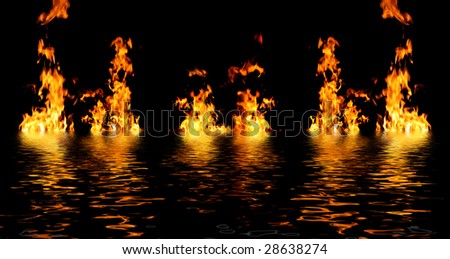 fire in the night with great flames reflecting in water