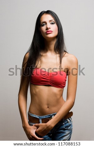 Half figure portrait of a beautiful skinny brunette.