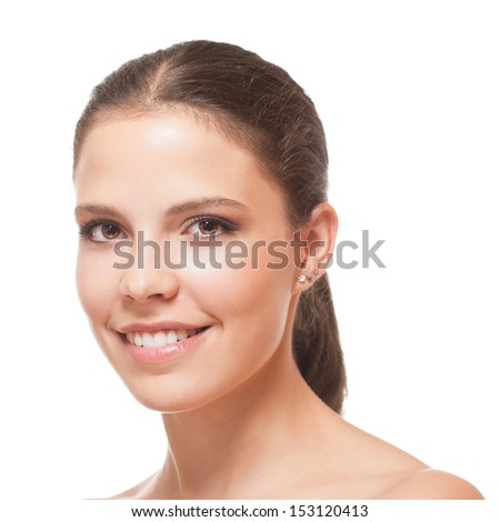 Closeup portrait of a young brunette beauty with healthy perfect skin.