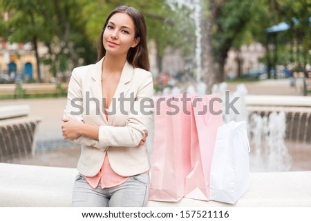 Portrait of an elegant attractive brunette shopping beauty.