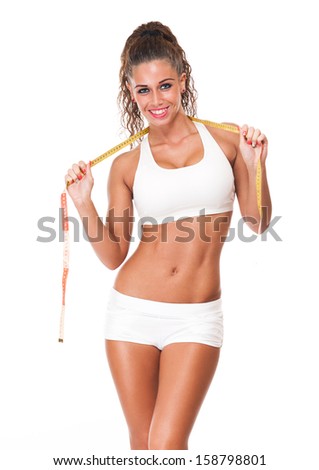 Portrait of a happy young brunette woman with perfect fit body.