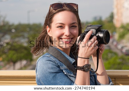 Gorgeous young brunette woman having photography fun.