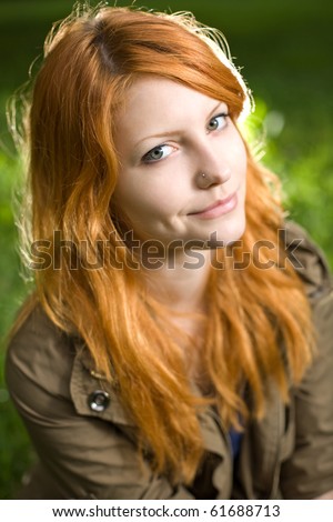 Beautiful redhead teen with dreamy romantic look.