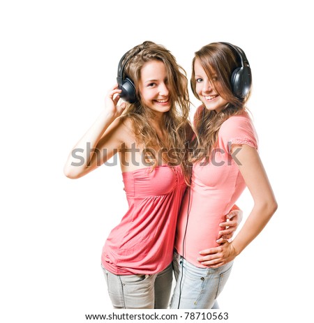 stock photo Share your tune two gorgeous brunette teens having fun with 