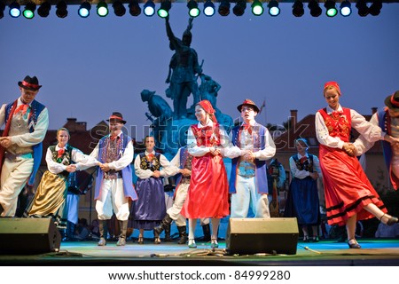 EGER - AUGUST 18: Traditional Polish folk dance performers on stage at night, as part of the St Stephen's Day's celebration, a national holiday in Hungary, on August 18, 2011 in Eger.