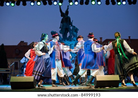 EGER - AUGUST 18: Traditional Polish folk dance performers on stage at night, as part of the St Stephen's Day's celebration, a national holiday in Hungary, on August 18, 2011 in Eger.
