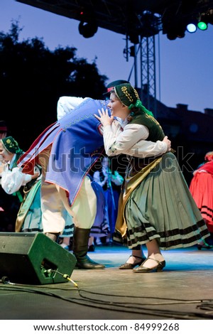 EGER - AUGUST 18: Traditional Polish folk dance performers on stage at night, as part of the St Stephen\'s Day\'s celebration, a national holiday in Hungary, on August 18, 2011 in Eger.