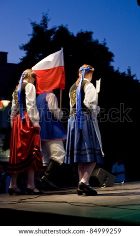 EGER - AUGUST 18: Traditional Polish folk dance performers on stage at night, as part of the St Stephen\'s Day\'s celebration, a national holiday in Hungary, on August 18, 2011 in Eger.