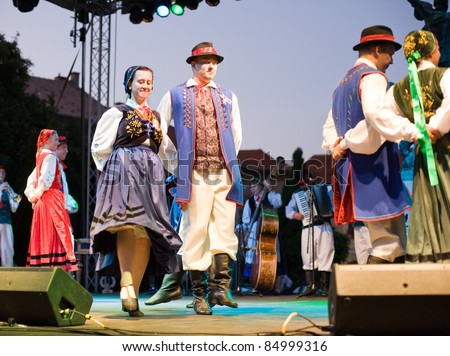 EGER - AUGUST 18: Traditional Hungarian folk dance performers on stage at night, as part of the St Stephen\'s Day\'s celebration, a national holiday in Hungary, on August 18, 2011 in Eger.