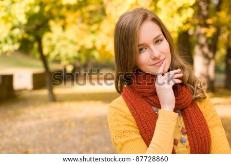 Portrait of colorful fall fashion woman with pondering gesture.