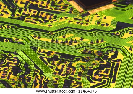 Backlit angled view of Circuit board showing wiring pathways that look like roads