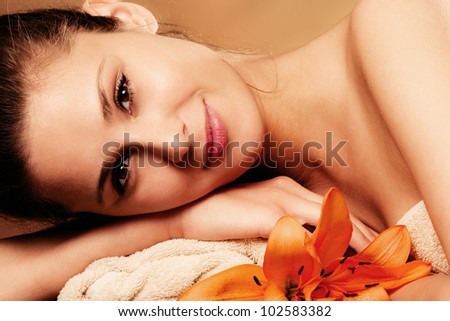 smiling natural beautiful woman in spa salon, relaxing, portrait