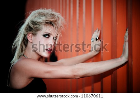 blond fashion model with punk hairstyle outdoor shot