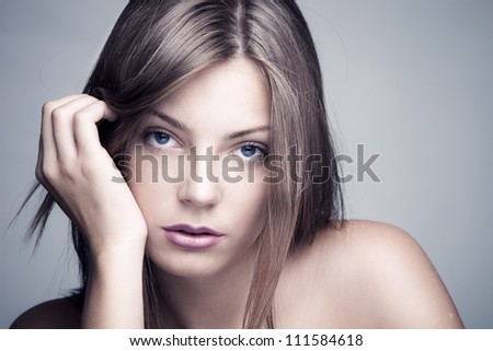 natural beautiful young blue eyed woman close-up shot