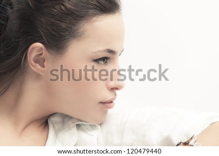 natural looking young woman portrait studio shot profile