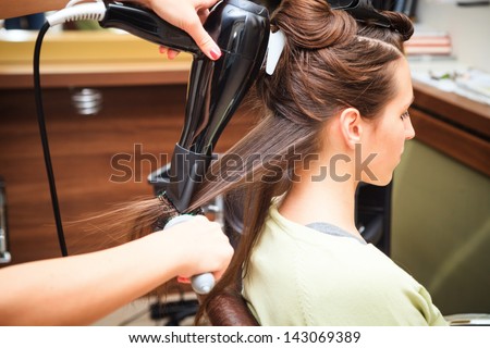 young woman at hairdresser do hairstyling