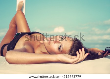 beauty shot of young woman on the beach