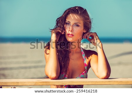 young woman in bikini  at shade at seaside beach enjoy in summer hot sunny day