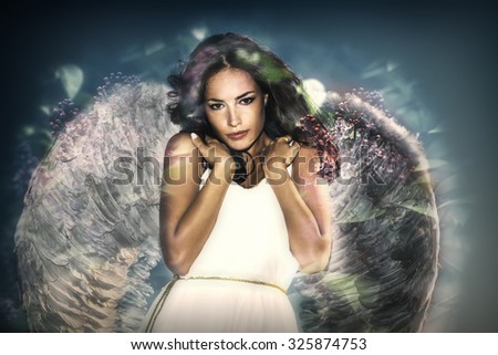 beautiful like angel young  woman with wings double exposure