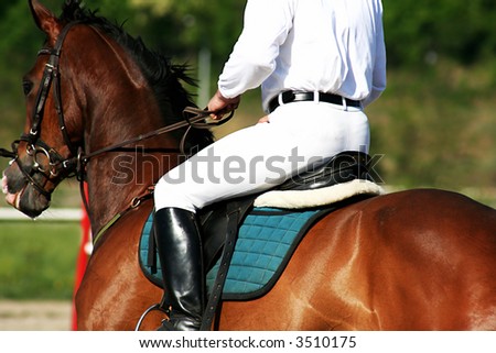 man riding horse, practicing before competition