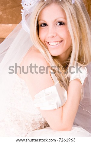stock photo bride sitting in wedding dress studio shot