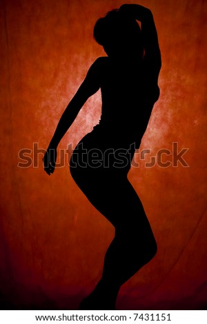 woman dance, silhouette in front of red background