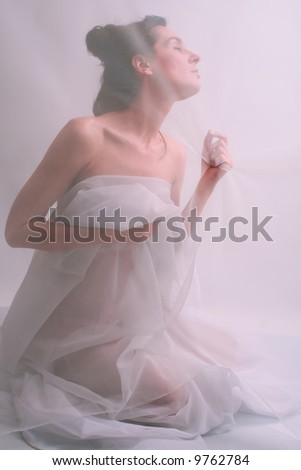 behind curtain, portrait of brunette woman