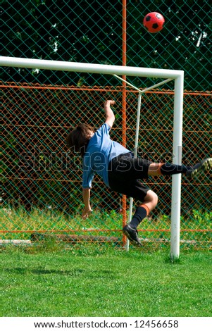 goal keeper jumped to the ball